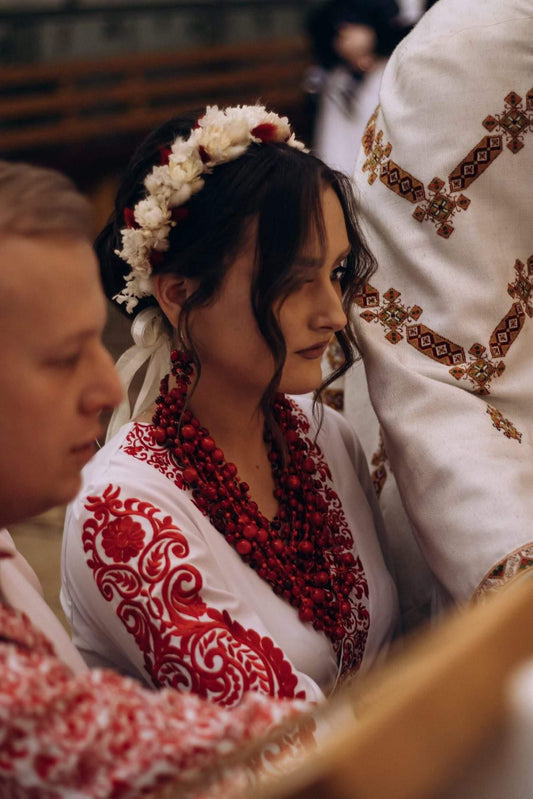 Glistening cherry red bead necklace with a mix of beads of varying sizes