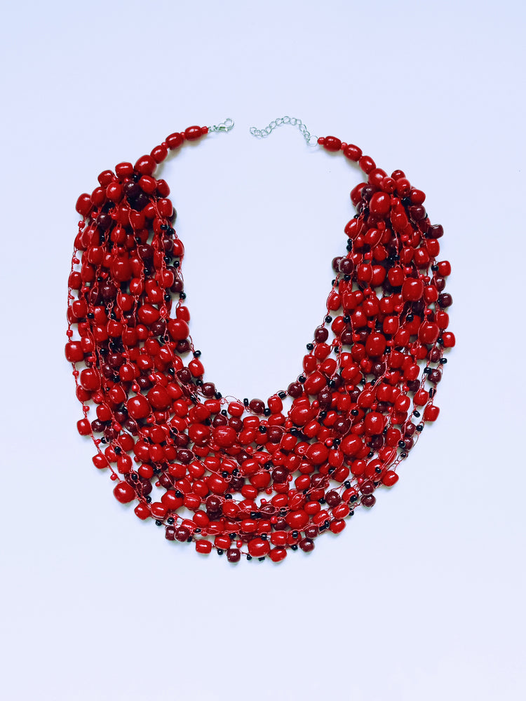 Glistening cherry red bead necklace with a mix of beads of varying sizes