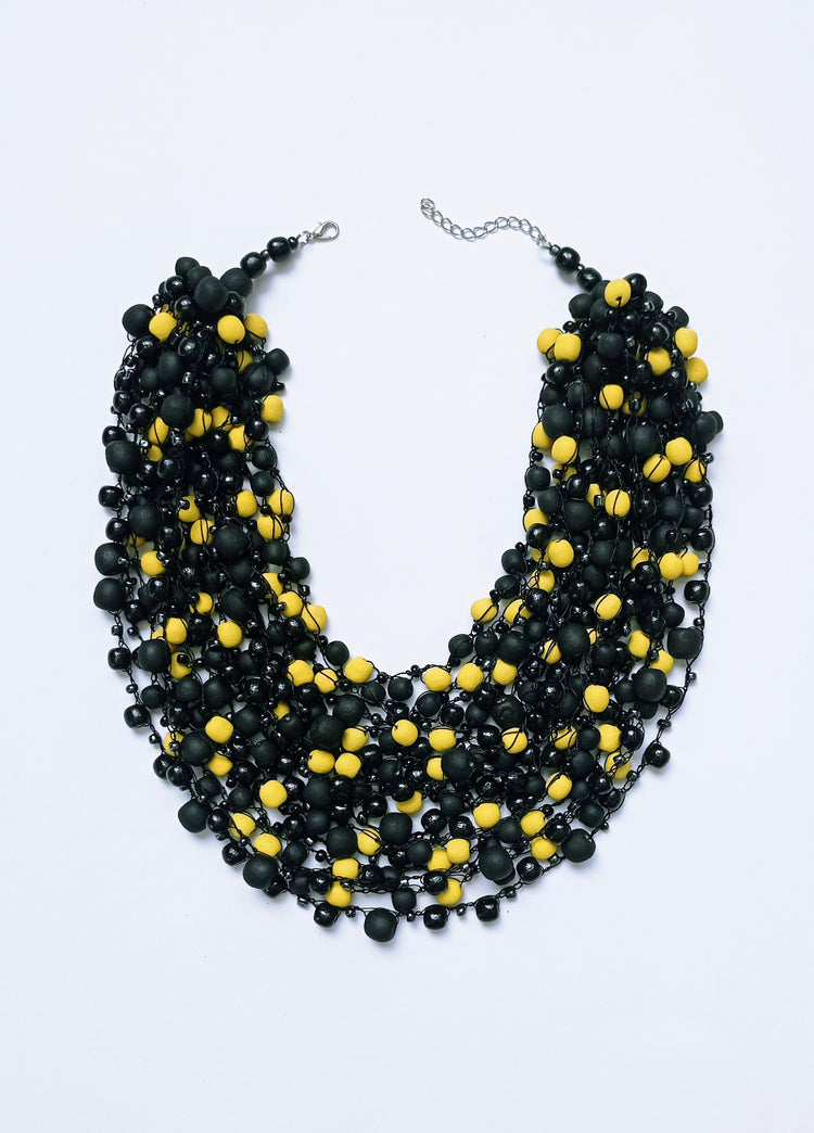 Black and yellow necklace with matte and glossy beads of different sizes